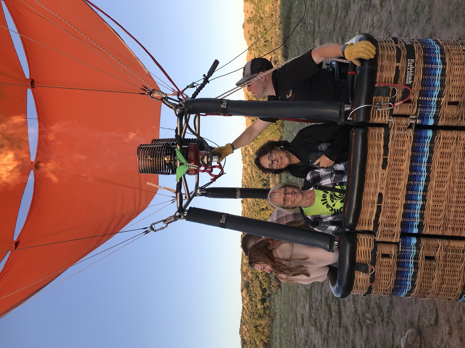 Josh flying passengers in a Kubicek basket over New Mexico
