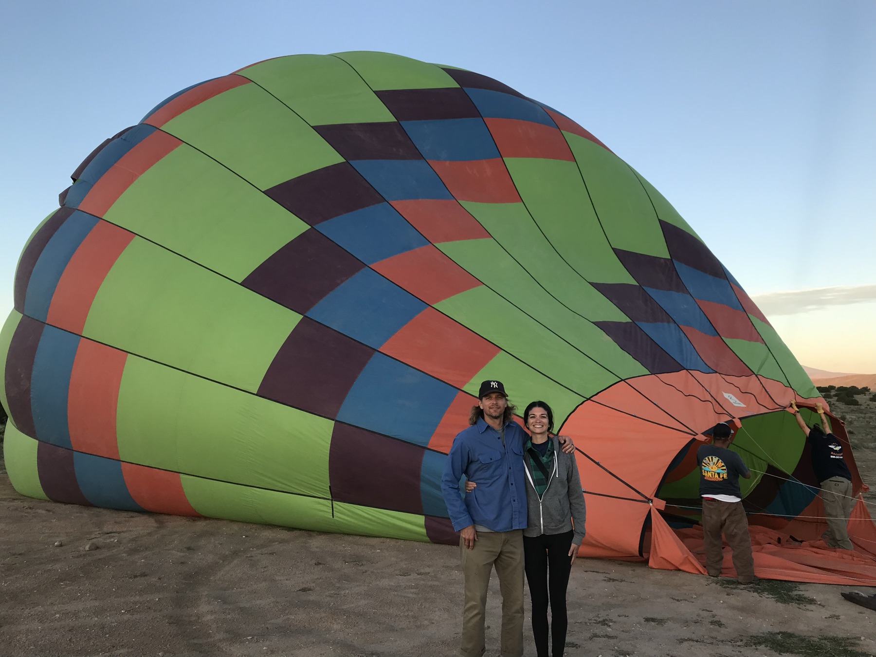 Passengers and Santa Fe Balloons crew during inflation in New Mexico